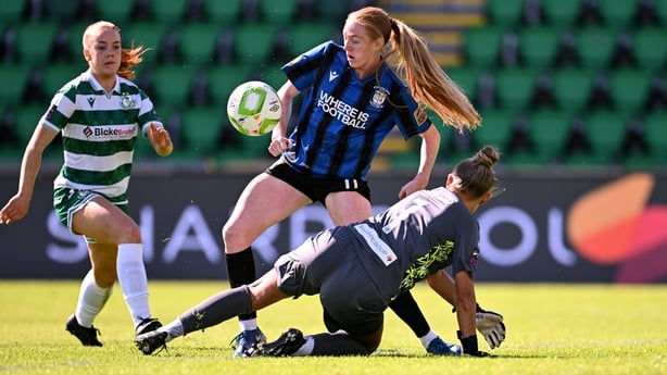 Kelly Brady of Athlone Town shoots at goal despite the attention of Shamrock Rovers goalkeeper Summer Lawless during the Sports Direct Women's FAI Cup semi-final match between Shamrock Rovers and Athlone Town at Tallaght Stadium in Dublin.
