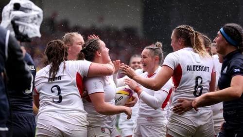 England celebrate their fourth try scored by Kelsey Clifford
