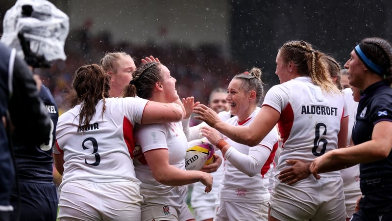 England celebrate their fourth try scored by Kelsey Clifford