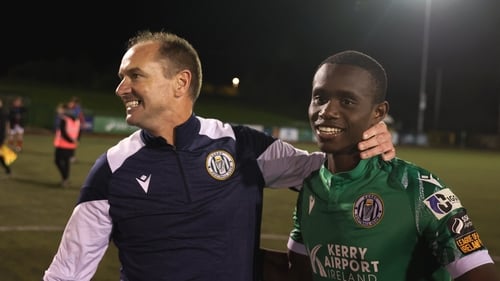 Kerry FC manager Colin Healy celebrates with Carl Mujaguzi after their remarkble quarter-final win