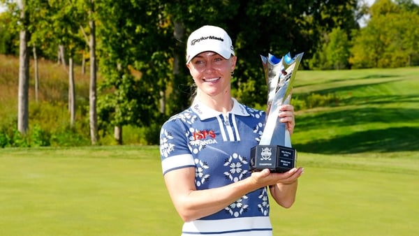 LPGA golfer Charley Hull poses with the trophy after winning the Kroger Queen City Championship on September 14, 2025, at TPC River's Bend in Maineville, Ohio.