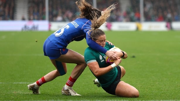 England , United Kingdom - 14 September 2025; Stacey Flood of Ireland scores her side's second try despite the tackle of Morgane Bourgeois of France during the Women's Rugby World Cup 2025 quarter-final match between France and Ireland at Sandy Park in Exeter, England. (Photo By Harry Murphy/Sportsf