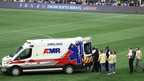 Savannah DeMelo #7 of Racing Louisville FC receives medical attention during the NWSL match between Seattle Reign and Racing Louisville, September 2025