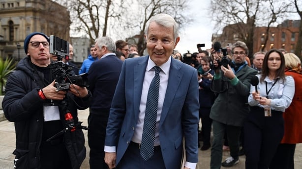 DUBLIN, IRELAND - JANUARY 22: Michael Lowry, independent TD, exits an impromptu press conference as the ongoing impasse continues at Leinster House before the ceremony for Micheál Martin, of the Fianna Fáil party, who will become the country's Taoiseach (prime minister) today for a second time on Ja