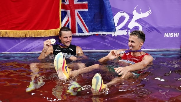 TOKYO, JAPAN - SEPTEMBER 15: Gold medalist, Geordie Beamish of Team New Zealand, and silver medalist, Soufiane El Bakkali of Team Morocco, celebrate with their medals following the Men's 3000 Metres Steeplechase Final on day three of the World Athletics Championships Tokyo 2025 at National Stadium o