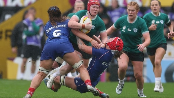 EXETER, ENGLAND - SEPTEMBER 14: Aoife Wafer of Ireland is tackled by Axelle Berthoumieu and Charlotte Escudero of France during the Women's Rugby World Cup 2025 Quarter Final match between France and Ireland at Sandy Park on September 14, 2025 in Exeter,