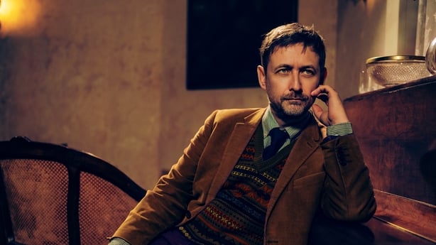 landscape shot of Neil Hannon of The Divine Comedy