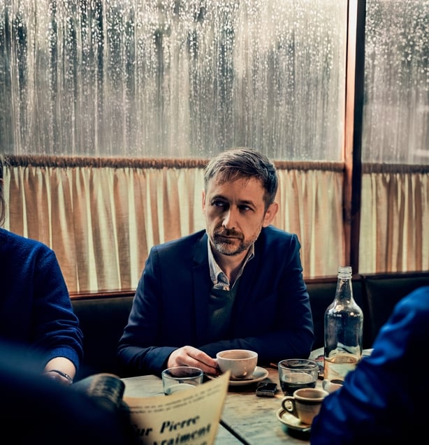 landscape shot of Neil Hannon of The Divine Comedy