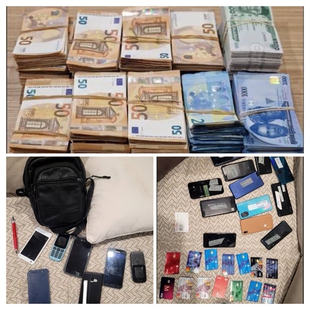 Photo of stacks of euro notes, phones and ATM cards