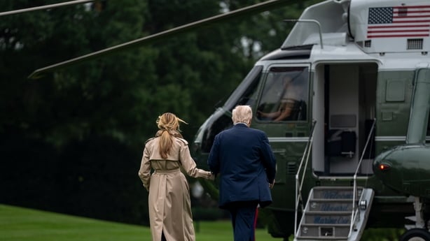 US President Donald Trump, right, and First Lady Melania Trump walk on the South Lawn of the White House before boarding Marine One in Washington, DC, US, on Tuesday, Sept. 16, 2025. Trump expects to announce economic deals totaling more than $10 billion during his trip this week to the United Kingd