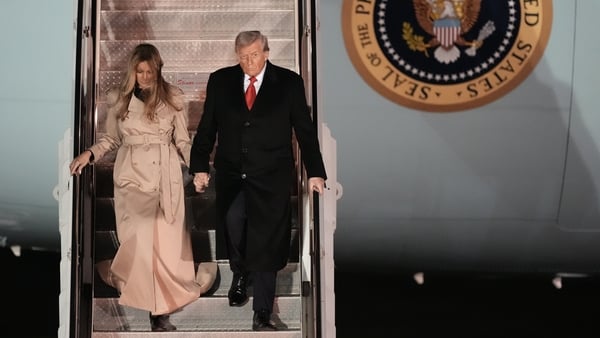 US President Donald Trump and First Lady Melania Trump arrive at Stansted Airport down the steps of air force one