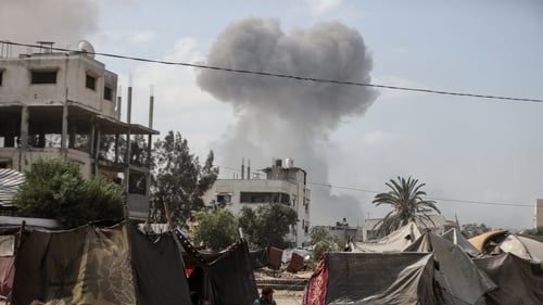 Smoke rises from a building in Gaza City following an attack by Israel