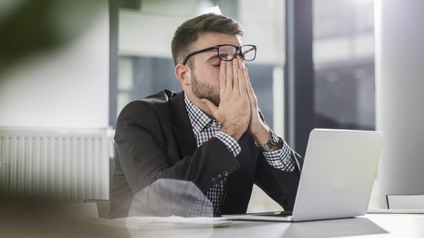 a man stressed in work