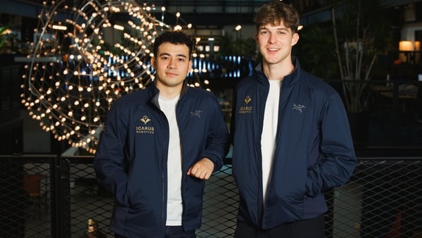 Images of 2 men standing in front of a scientific creation