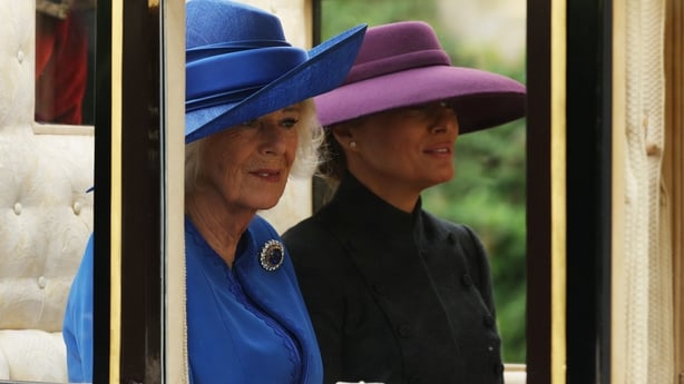 Britain's Queen Camilla and US First Lady Melania Trump travel in the The Scottish State Coach during a horse-drawn procession towards Windsor Castle