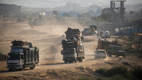 Displaced Palestinians moving their belongings towards the south of Gaza