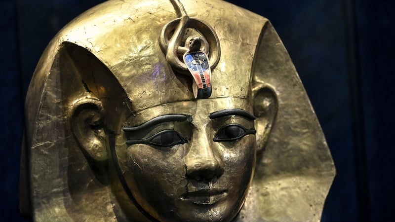 The bracelet dates back to the reign of Amenemope, whose gilded wooden mask is pictured above