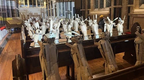 Cardboard hares fill the pews in Kylemore Abbey as part of an interactive installation called 'March'
