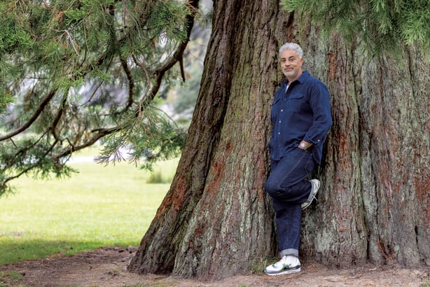 Baz Ashmawy leaning against a tree