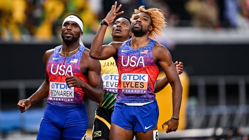 Noah Lyles celebrates with his four-finger salute as he edges Kenny Bednarek, once again, in the 200m final
