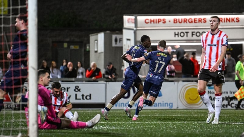 Mipo Odubeko, left, celebrates with Shelbourne team-mate Daniel Kelly after claiming his side's equaliser at the Brandywell