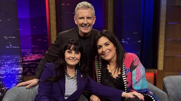 Patrick Kielty along side Marian Keyes and Stefanie Preissnersmile towards the camera in The Late Late Show studio