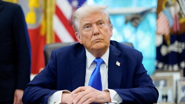 US President Donald Trump speaks to members of the media in the Oval Office of the White House in Washington