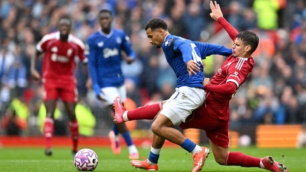 Iliman Ndiaye of Everton is challenged by Milos Kerkez of Liverpool during the Premier League match between Liverpool and Everton at Anfield on September 20, 2025 in Liverpool