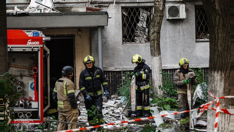 Ukrainian rescue workers conduct a search operation after a Russian attack on a residential building in Dnipro