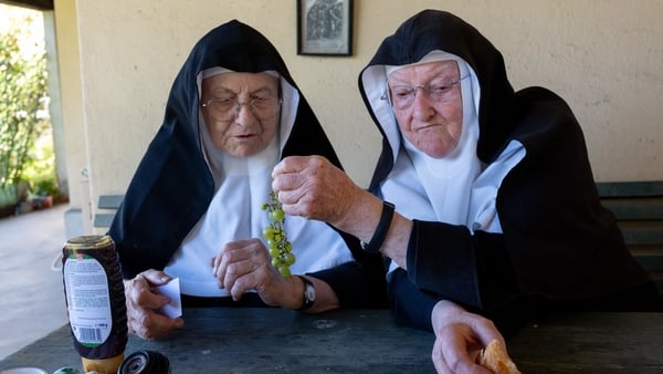 Sister Bernadette (right), 88, and Sister Rita (left) take a morning snack after the mass outside the convent chapel of the Goldenstein castle