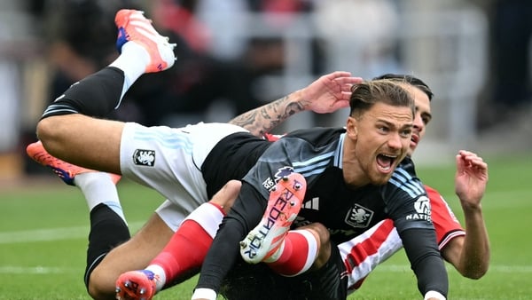 Aston Villa's English-born Polish defender Matty Cash vies with Sunderland's French midfielder Enzo Le Fee during the English Premier League football match between Sunderland and Aston Villa at The Stadium of Light in Sunderland in north east England