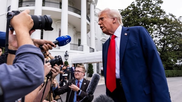 Donald Trump speaks to media outside the White House