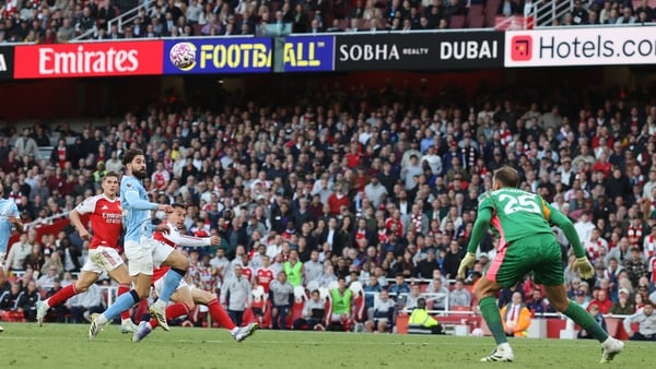LONDON, ENGLAND - SEPTEMBER 21: Gabriel Martinelli of Arsenal lifts the ball over Manchester City goalkeeper Gianluigi Donnarumma to score the equalising goal during the Premier League match between Arsenal and Manchester City at Emirates Stadium on Septe