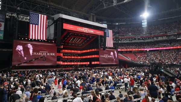 Attendees await the start of the memorial service for political activist Charlie Kirk at State Farm Stadium in Glendale, Arizona