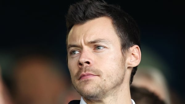 LUTON, ENGLAND - FEBRUARY 18: Harry Styles, English Singer, looks on prior to the Premier League match between Luton Town and Manchester United at Kenilworth Road on February 18, 2024 in Luton, England. (Photo by Catherine Ivill/Getty Images)