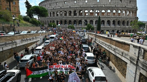 People march near the Colosseum during a nationwide strike