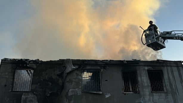 Firefighters work at the site of a Russian airstrike on September 22, 2025 in Zaporizhzhia, Ukraine