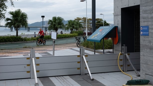 Temporary flood barriers are erected in a park as Super Typhoon Ragasa approaches Hong Kong 