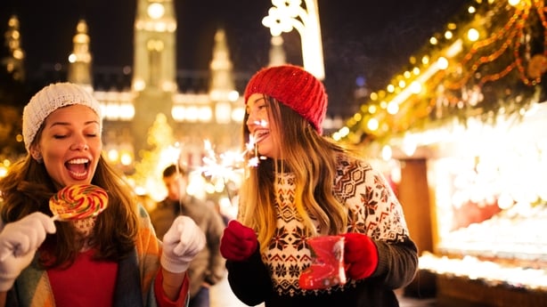 Girl friends having fun and enjoying on Christmas market