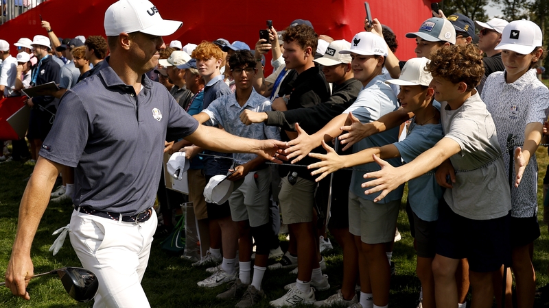 Thomas interacts with fans during practice on Tuesday