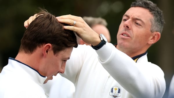FARMINGDALE, NEW YORK - SEPTEMBER 23: Rory McIlroy of Team Europe fixes the hair of teammate Matt Fitzpatrick for a team photo prior to the Ryder Cup 2025 at Black Course at Bethpage State Park Golf Course on September 23, 2025 in Farmingdale, New York. (