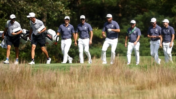 FARMINGDALE, NEW YORK - SEPTEMBER 23: (L-R) Collin Morikawa, vice captain Webb Simpson, Scottie Scheffler, vice captain Kevin Kisner, Harris English and Russell Henley of Team United States walk the 13th hole prior to the Ryder Cup 2025 at Black Course at
