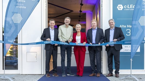 Group of people about the cut the ribbon on a new manufacturing facility
