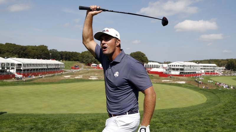 Bryson DeChambeau acknowledges the crowds at the first tee at Bethpage