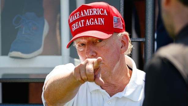 BEDMINSTER, NJ - AUGUST 13: Former President Donals J. Trump greets golfers at the first tee during the final round of LIV Golf Bedminster on August 13, 2023 at Trump National Golf Club in Bedminster, New Jersey. (Photo by Rich Graessle/Icon Sportswire via Getty Images)