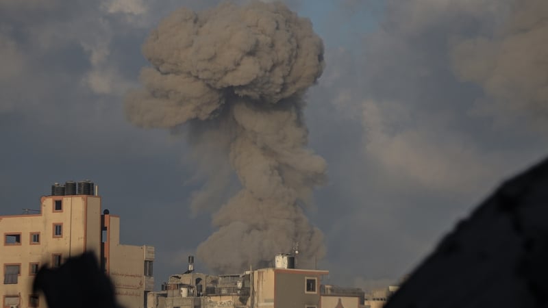 Smoke rises from the Tel al-Hawa neighborhood