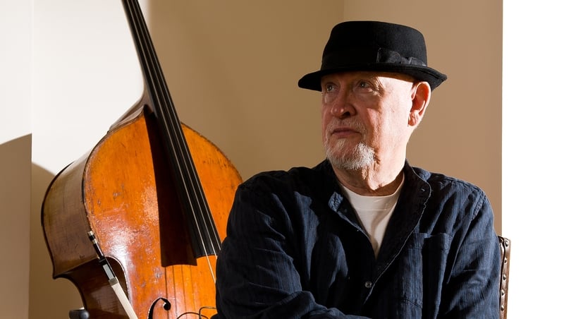 Danny Thompson posing with his 1865 Gand double bass 'Victoria' in 2012. Photo credit: Will Ireland/Prog Magazine