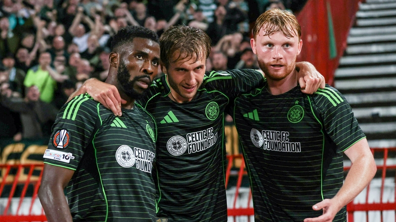 Liam Scales (R) celebrates Celtic's goal with scorer Kelechi Iheanacho (L) and Benjamin Nygren (C)