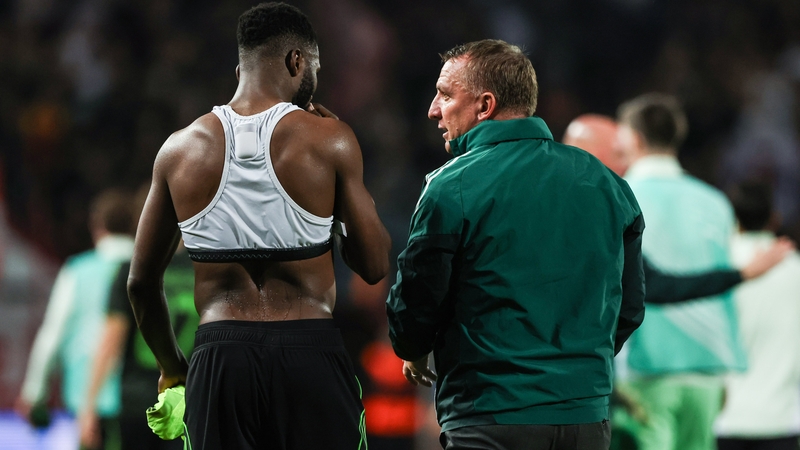Celtic manager Brendan Rodgers (R) speaks to Kelechi Iheanacho at full time