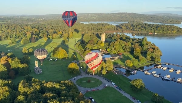 Three hot air balloons in the skies above Lough Key Forest Park
